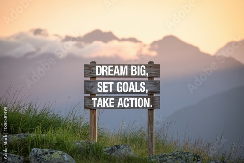 Rustic wooden sign with motivational quote in mountain landscape dream big set goals
