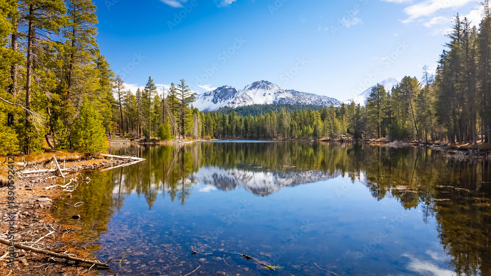 Fototapeta premium Snowy Lassen Peak reflected in Manzanita Lake waters