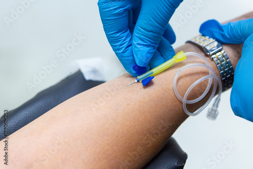 Healthcare Professional Collecting Blood Sample from Patient in Clinical Laboratory