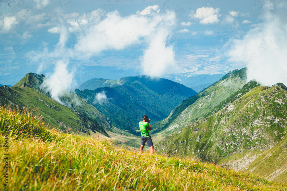 Obraz premium trekking with a dog in hogh mountains