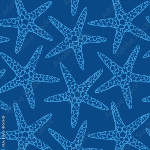 Seamless blue starfish pattern with organic dotted texture on deep navy background. Repeating sea star marine design for summer beach wallpaper, fabric, wrapping paper, textile print.