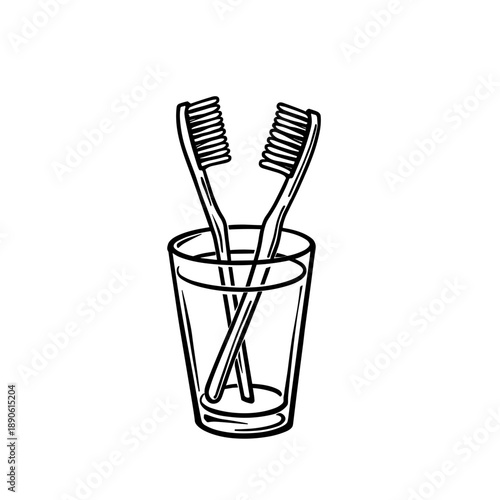 Toothbrushes in a glass container for daily dental hygiene  