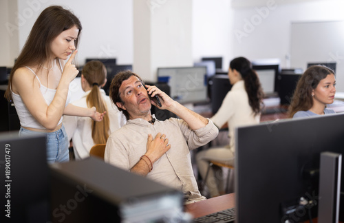 Female teacher urged to keep quiet over man talking loudly on phone during university exam