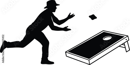 Man in silhouette throwing beanbag at cornhole board game