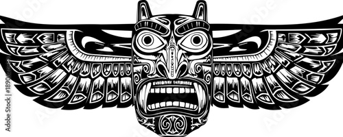 A stylized owl head with outstretched wings in a traditional Pacific Northwest Native American totem pole design