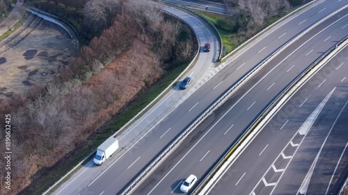 Highway Junction Aerial: An aerial view captures a complex highway interchange, where multiple roads converge and diverge.