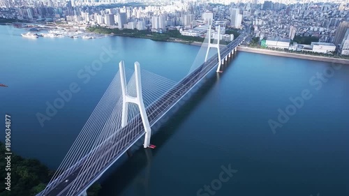 View of a bridge over water in a city on a sunny day