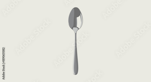A single polished metal spoon isolated on a plain background.