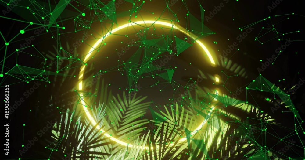 Fototapeta premium Highlighting glowing neon ring emitting yellow light in studio set, with palm fronds and green mesh