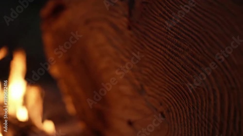 Abstract Fiery Refraction Macro view focusing purely on the subtle refraction and gentle motion of firelight, creating an abstract background of shifting colors and soft, warm light patterns.