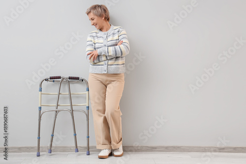 Mature woman with walker ne...