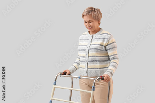 Mature woman with walker on...