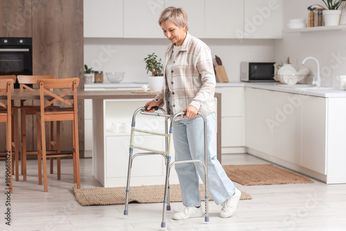 Mature woman using walker i...