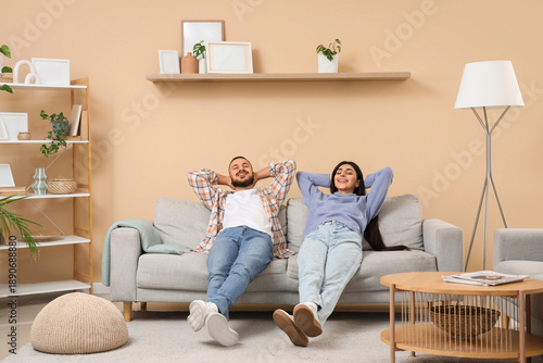Young couple resting on gre...