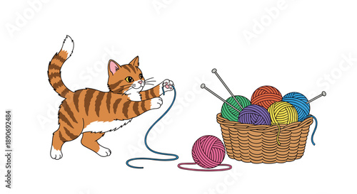 Playful orange tabby kitten playing with a ball of blue yarn next to a wicker basket full of colorful knitting wools.