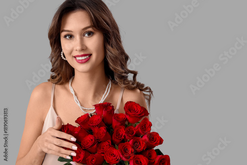 Smiling young woman with bo...