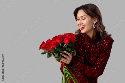 Happy young woman with bouq...