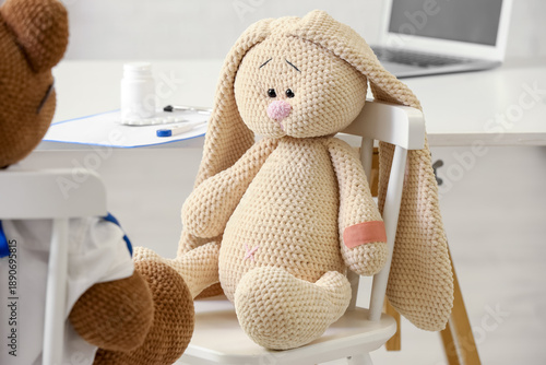 Toy bunny with medical patc...