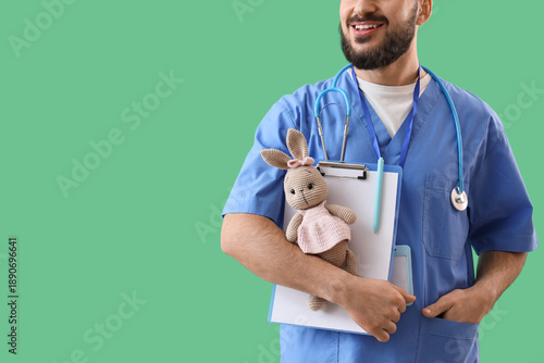 Male pediatrician with toy ...