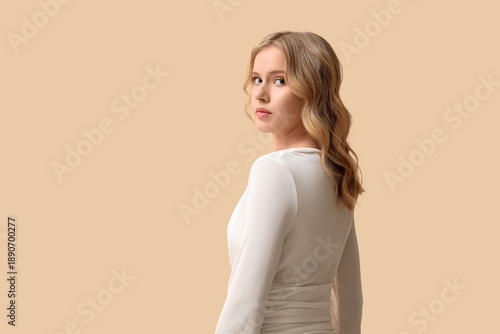 Blonde young woman with cur...