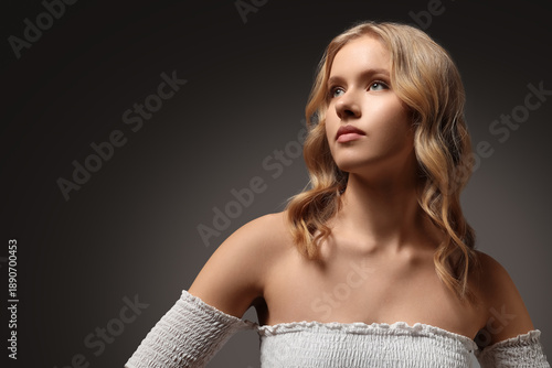 Blonde young woman with bea...