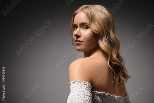 Blonde young woman with cur...
