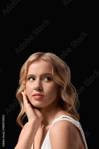 Blonde young woman with cur...