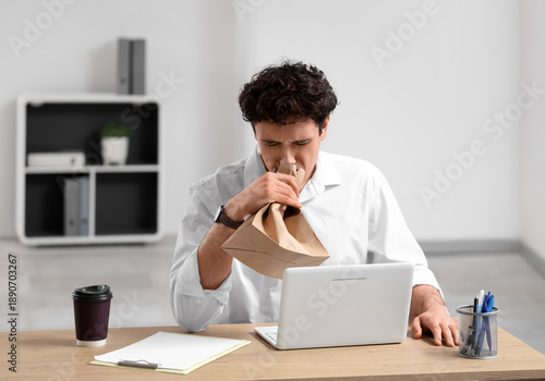 Young businessman with pape...