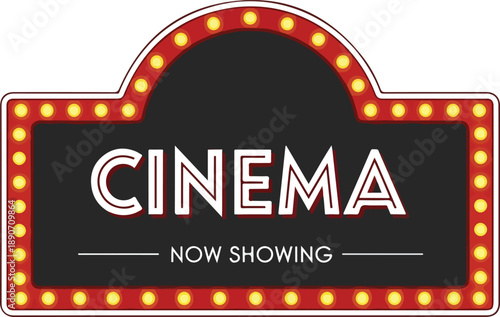 Classic cinema marquee signboard illuminated with vibrant lights at night in a city location