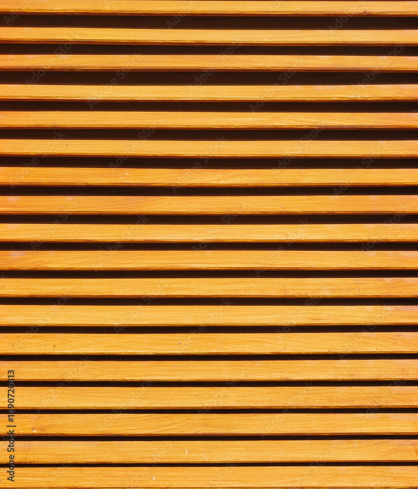 Fototapeta premium Horizontal wooden slat pattern featuring warm orange tones and clean geometric lines, providing a versatile texture for architectural and background designs