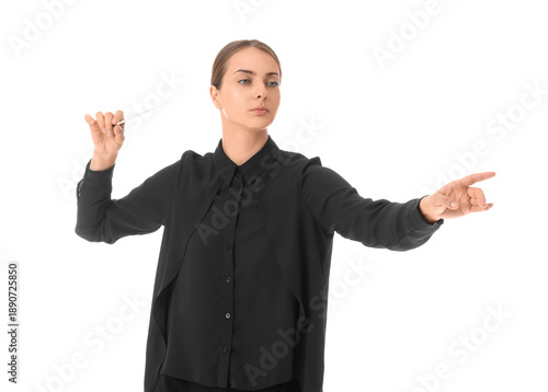 Young female conductor with baton on white background
