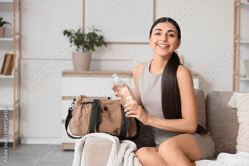 Sporty young woman with bot...