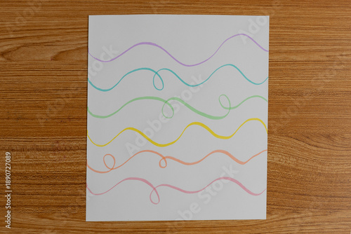 Minimal Colorful Wavy Line Drawing on White Paper Background
