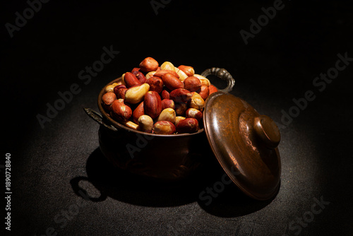Roasted Small Red Peanuts without Salt in a vintage metallic pot
