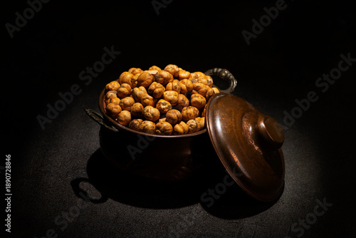 Roasted chickpeas with Pepper in a vintage metallic pot