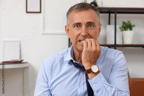 Worried mature businessman ...
