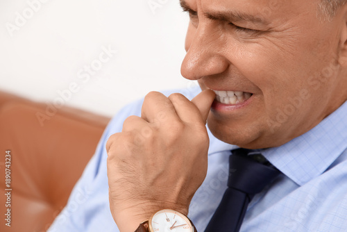 Worried mature businessman ...