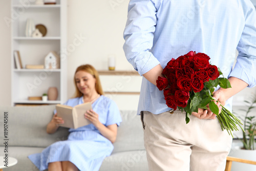 Mature man greeting his wif...