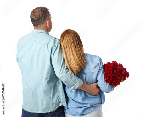 Mature couple with bouquet of roses isolated on white background, back view. ...