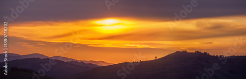 Photography Picturesque sunset in the mountains, hills on the horizon, panoramic view