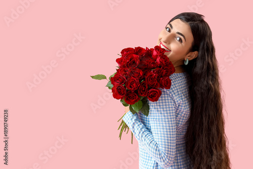 Happy young woman with bouq...