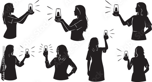 Silhouette of women taking photos with smartphone in hand