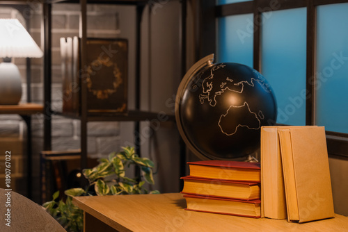 Books with globe on table i...