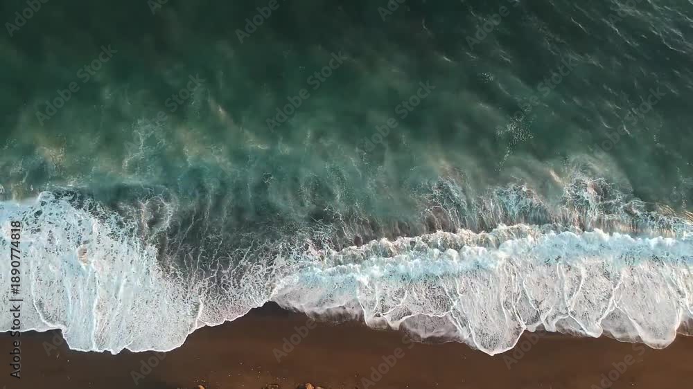 This Ocean Sea Waves Drone Aerial View stock footage presents a ...