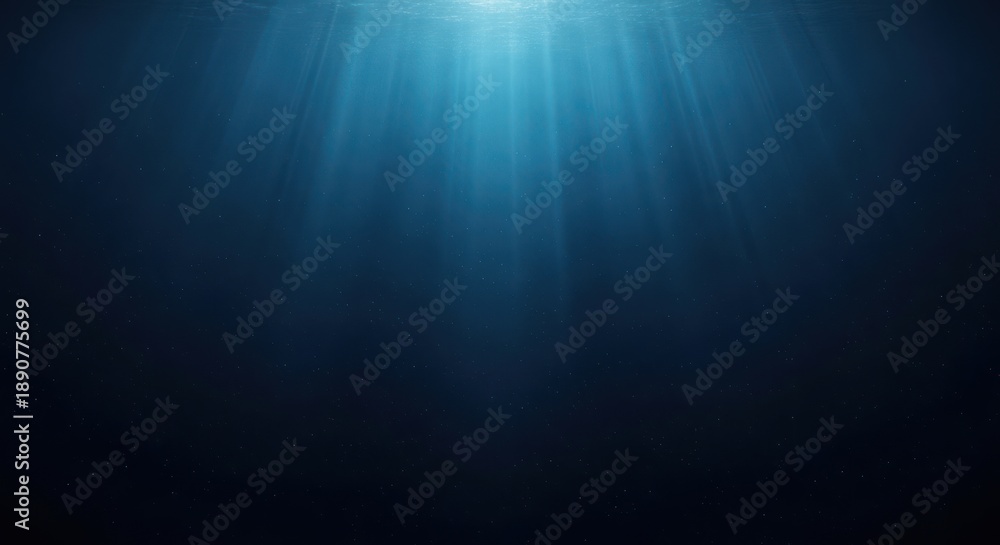Obraz premium Abstract underwater scene with sunlight beams and dark blue background