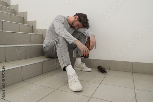 Drunk man sitting on stairs...
