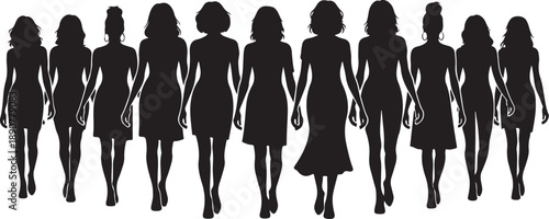 Silhouettes of women walking in a line together outside