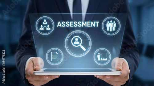 Professional man holding a tablet displaying glowing digital assessment icons in a corpora