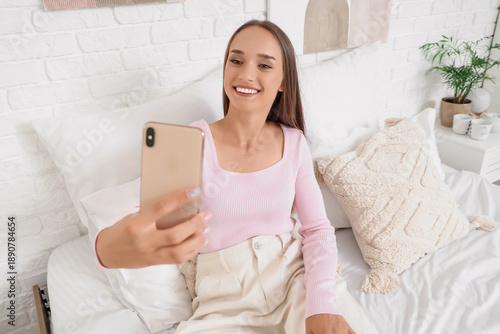 Young woman with mobile pho...