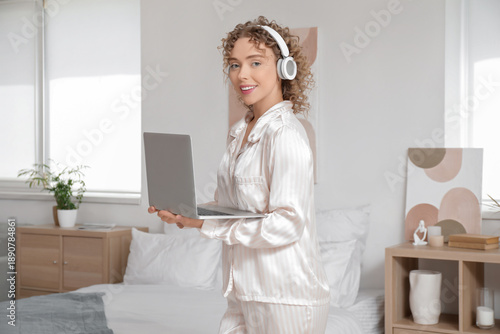 Young woman with headphones...